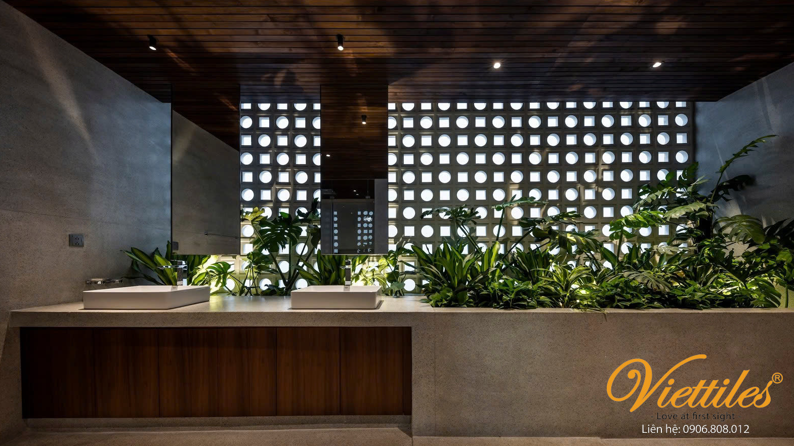 Why do many cafés and luxury resorts prefer handmade tiles instead of industrial tiles?